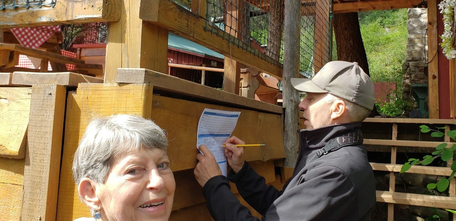 A Neighborhood Ambassador learning the Home Wildfire Risk Assessment from a mentor