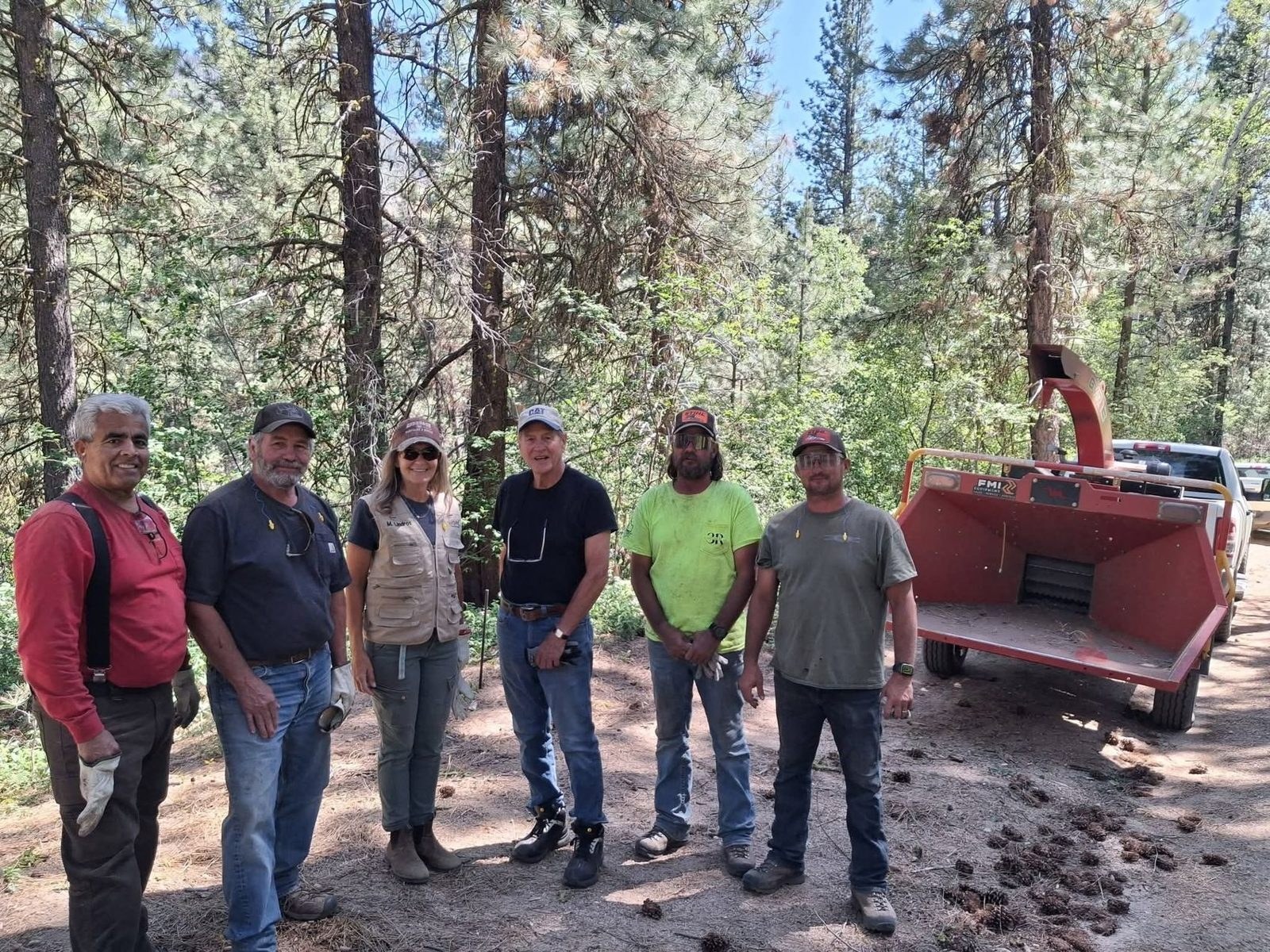 Neighbors and friends of Lowman gathered with the chipper